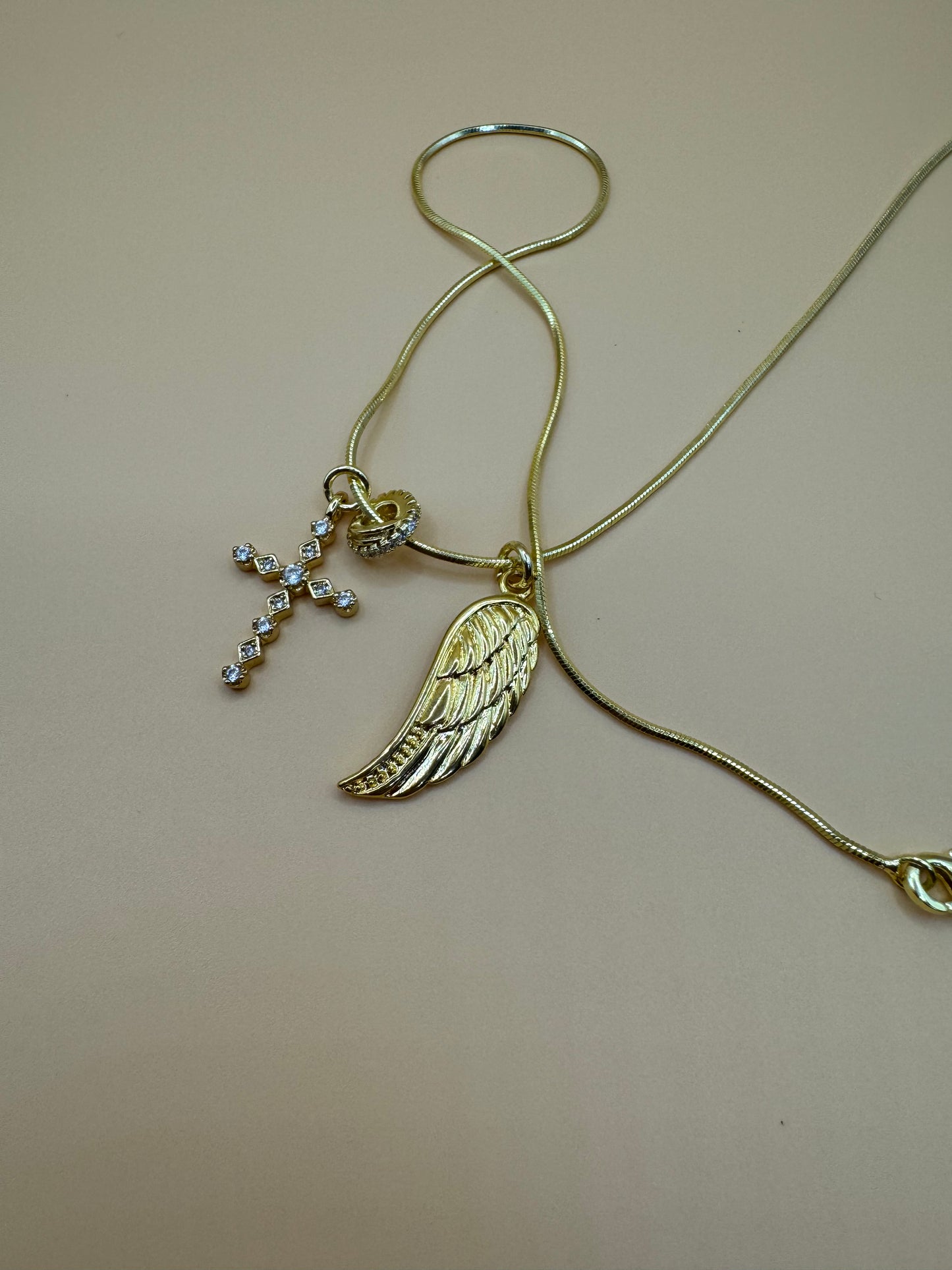 Cross and feather necklace