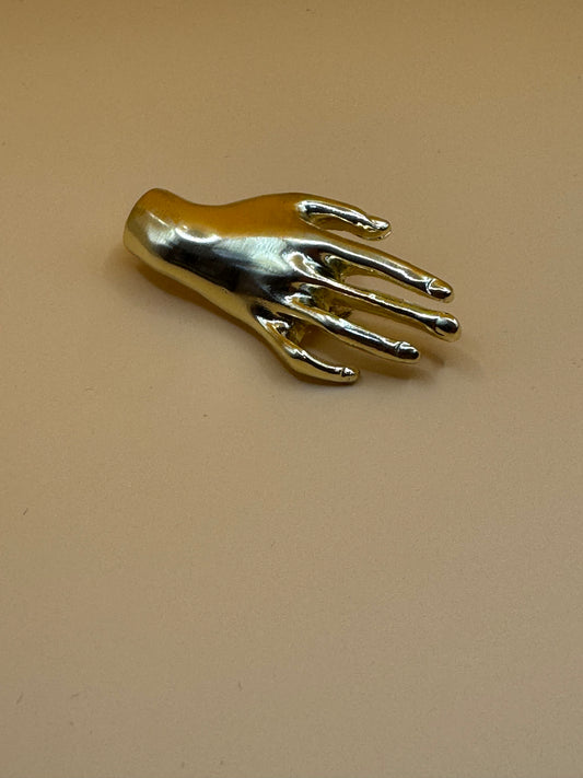 Right hand brooch