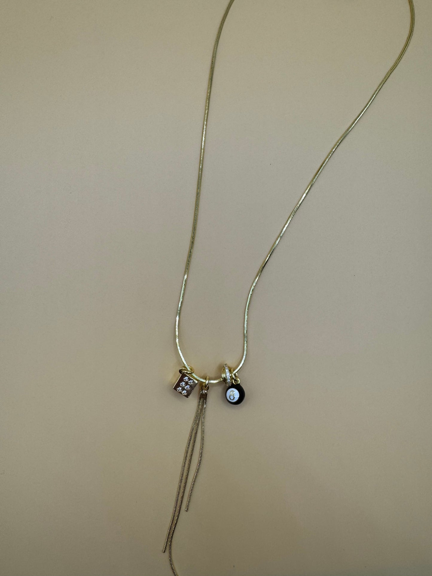 Eight ball tassel necklace