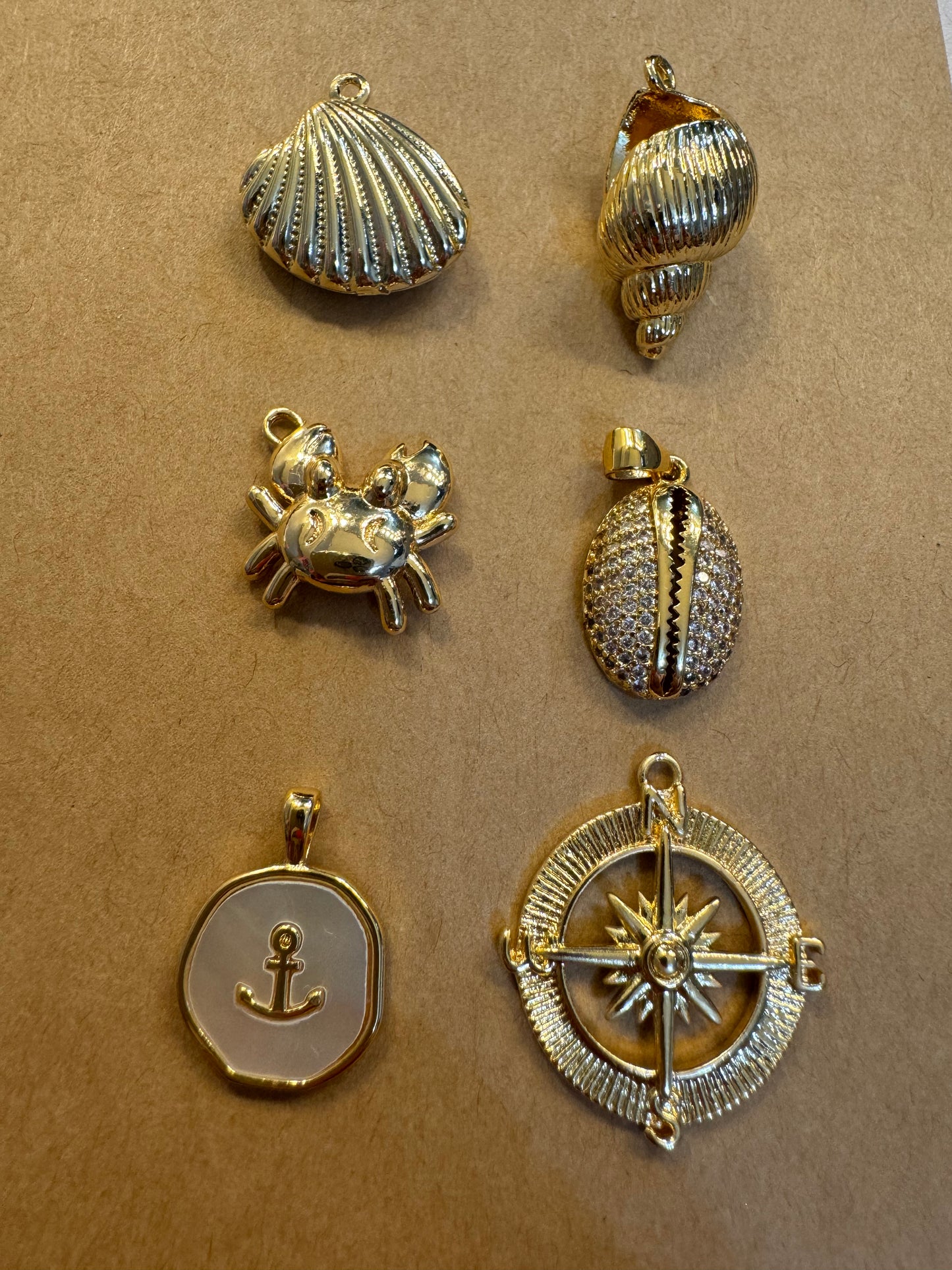 charms- shells and compass