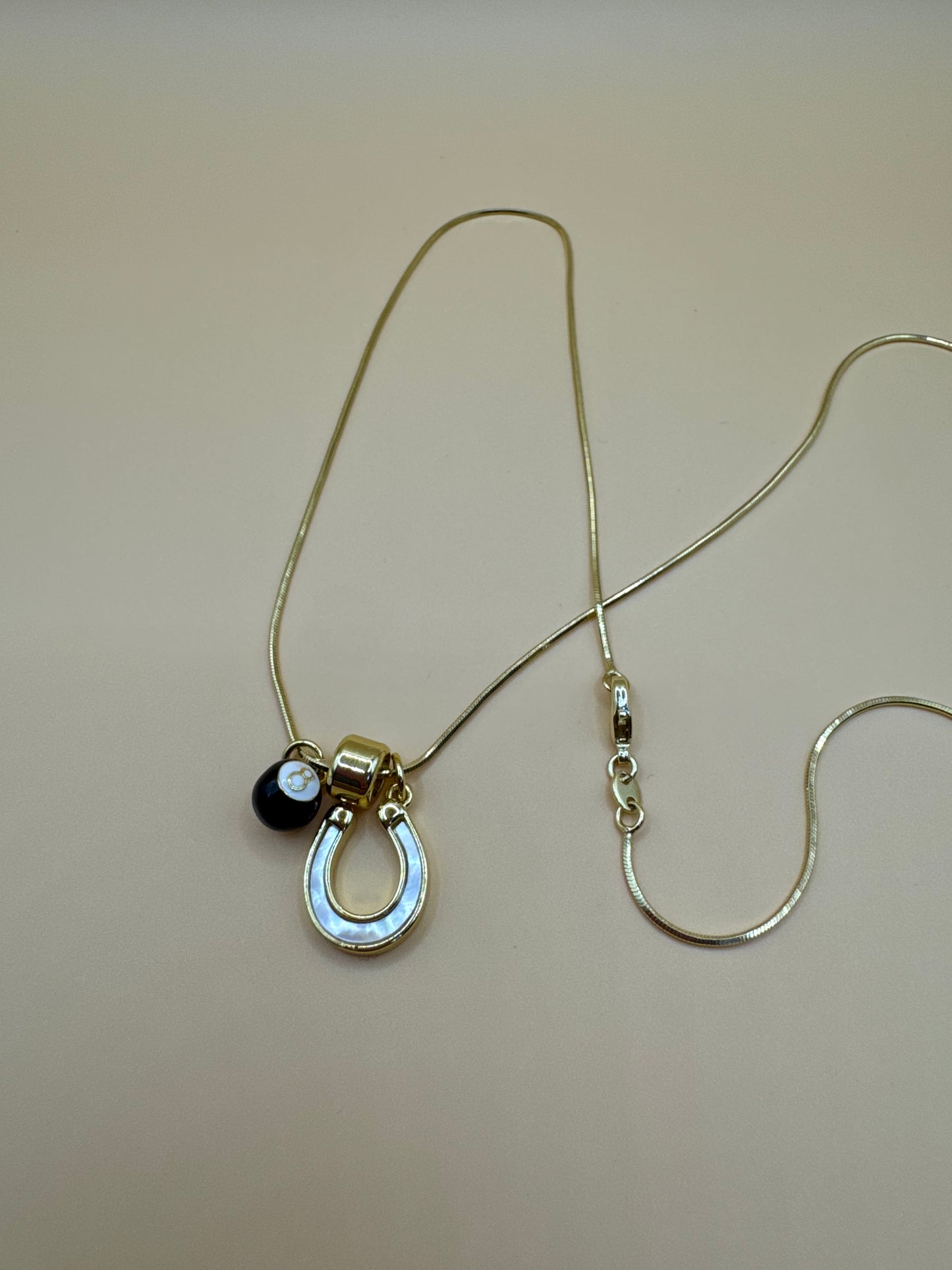 Eight ball horse shoe necklace